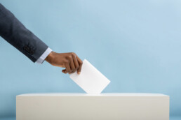 An image of an African man's hand placing a vote in a ballot box | 2022 General Elections in Kenya