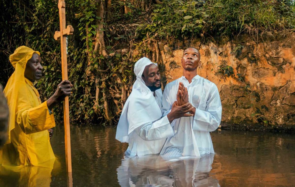 A screenshot from pepeta Season 1 showing Junior (Brahim Ouma) being baptized. | Image: Showmax